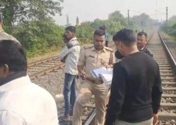 A woman's body was found on a railway track in Dhanbad, causing panic in the area - police are investigating.