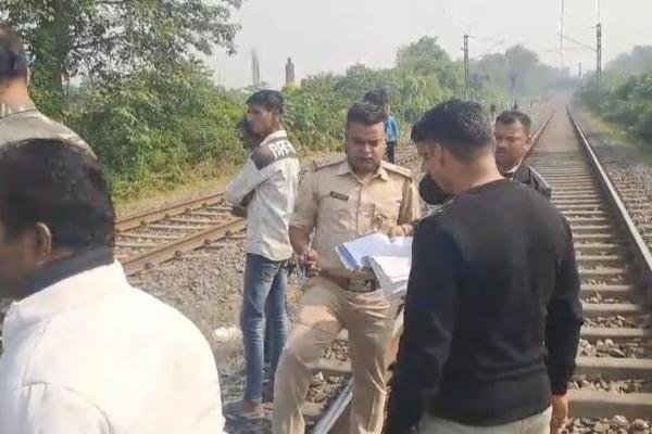 A woman's body was found on a railway track in Dhanbad, causing panic in the area - police are investigating.