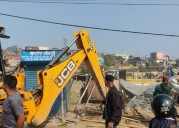Corporation bulldozers crack down on illegal encroachments along the Harmu River, demolishing over 50 structures