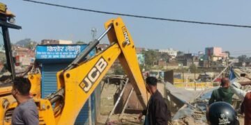 Corporation bulldozers crack down on illegal encroachments along the Harmu River, demolishing over 50 structures