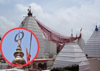 Devotees gather as Panchshul is removed from the shrine of बाबा बैद्यनाथ धाम ahead of Mahashivratri.