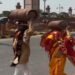 Amid the LPG crisis, a unique video of a newlywed couple carrying a cylinder on their head goes viral.