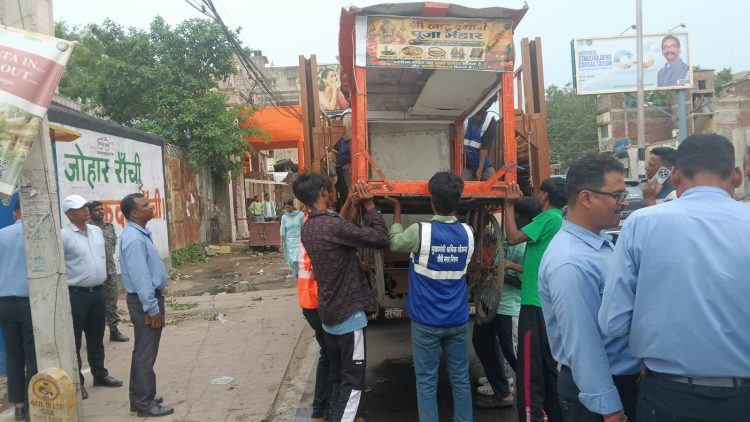Municipal Corporation's major anti-encroachment drive in Ranchi; bulldozers raze illegal riverside constructions and meat shops.