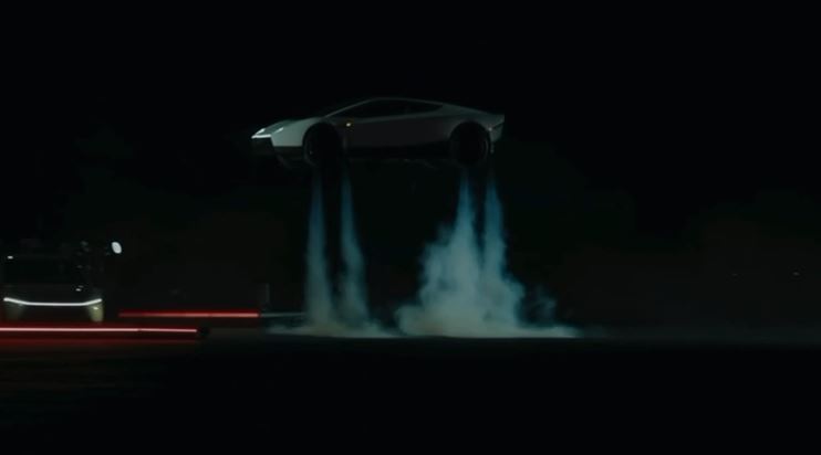 Tesla ने दिखाई उड़ने वाली रोडस्टर, हवा में पलटकर सुरक्षित उतरी कार 1 Tesla reveals a flying Roadster; the car flips in mid-air and lands safely.
